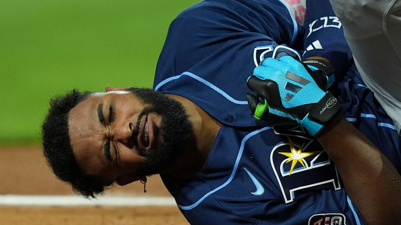 Tampa Bay Rays slugger Junior Caminero reacts after being hit by a pitch by St. Louis Cardinals' Riley O'Brien in the 3rd inning of the Major League Baseball All-Star Game on Tuesday, July 14, 2026, in Philadelphia. (AP Photo/Matt Rourke)
