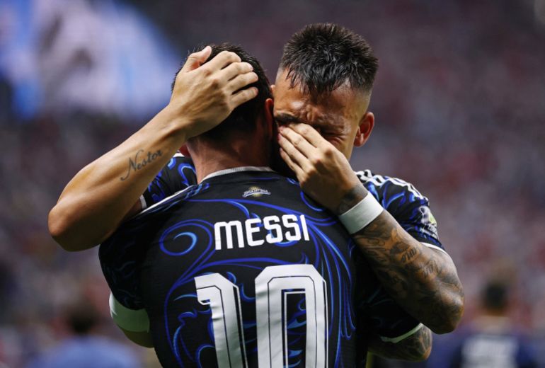Soccer Football - FIFA World Cup 2026 - Semi Final - England v Argentina - Atlanta Stadium, Atlanta, Georgia, U.S. - July 15, 2026 Argentina's Lautaro Martinez celebrates scoring their second goal with Lionel Messi REUTERS/Agustin Marcarian