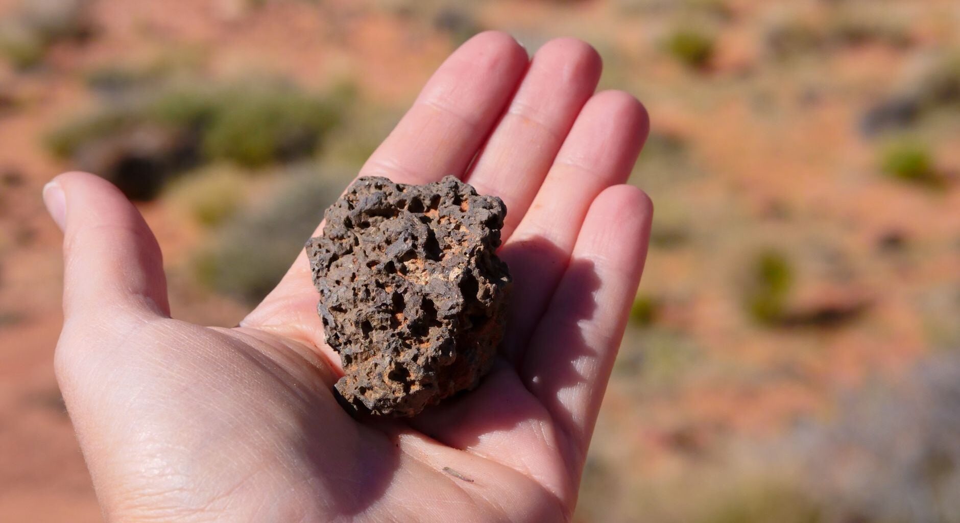 A rare meteorite found in the Sahara may be a surviving shard of a lost Moon-sized world — one that formed beside the young Sun, followed a path unlike Earth or Mars, and was smashed apart while the planets were still being built.
