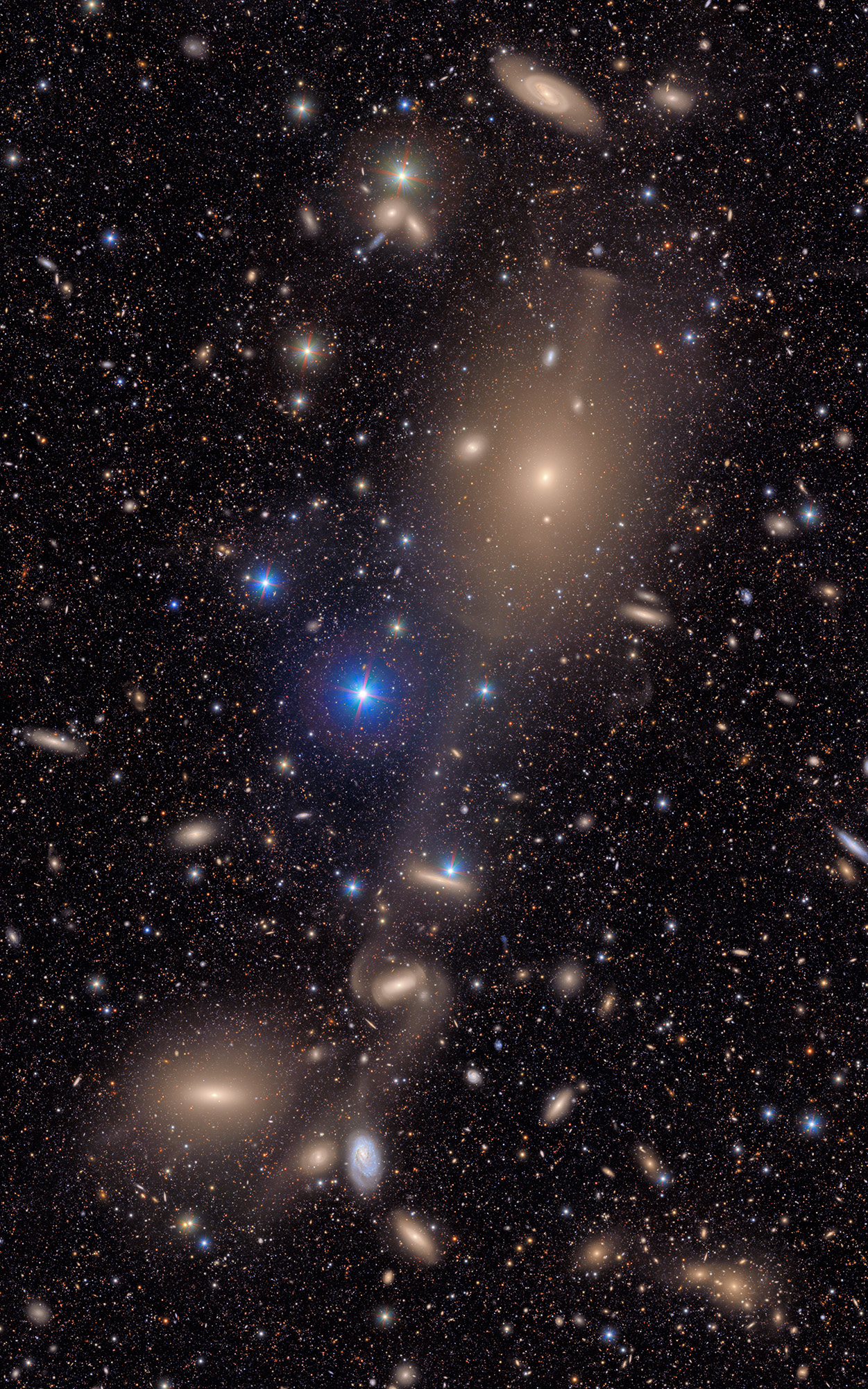An image of deep space, with various glowing galaxies.