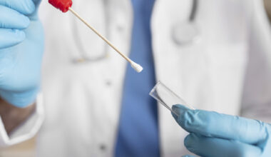 Close Up of Doctor With Swab Collection Kit. Test Tube for Taking Op Np Patient Specimen Sample, Pcr Dna Testing Protocol Process. Selective Focus on Sample.