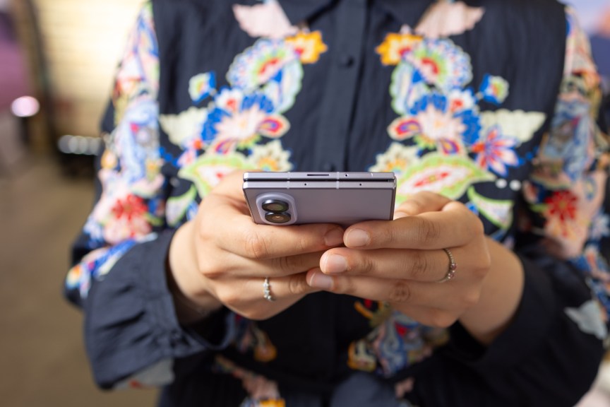 A woman holding the Galaxy Z Fold 8
