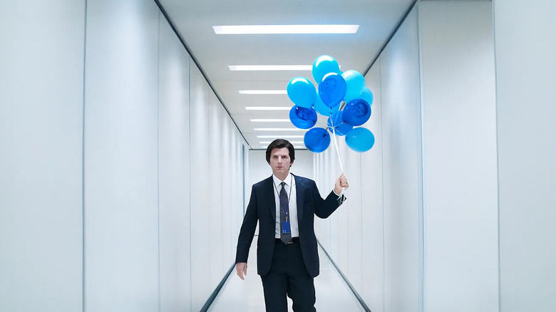 Adam Scott as Mark S., walking down the hallway with balloons in Severance.