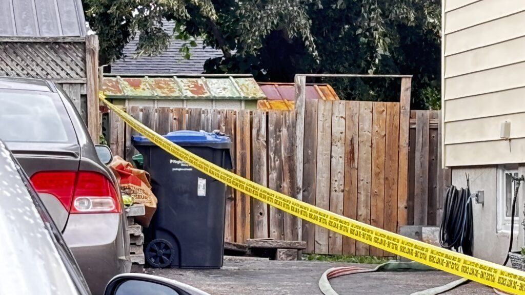 Police tape cordons off a shed where a male was found deceased on July 9, 2026. David Misener/CityNews.