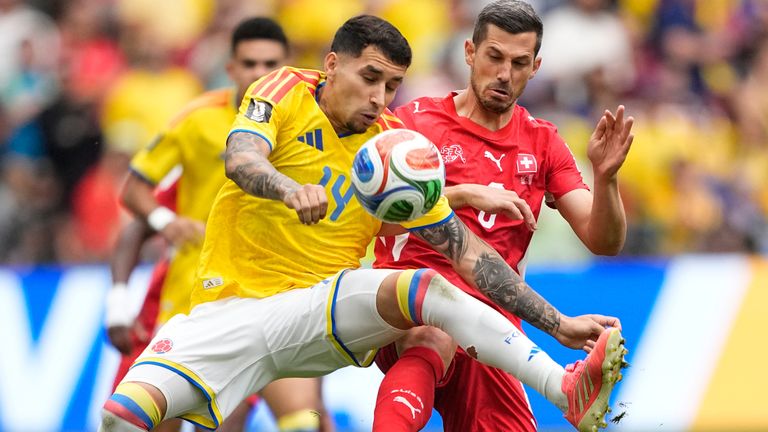 Colombia's Gustavo Puerta and Switzerland's Remo Freuler battle for the ball