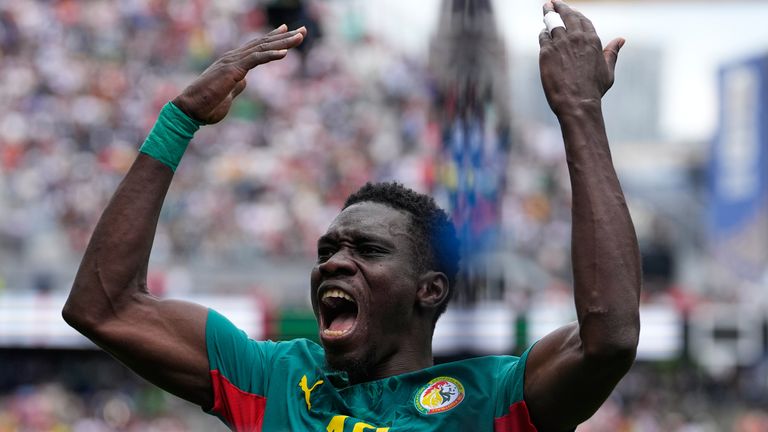 Senegal's Ismaila Sarr (18) celebrates scoring against Belgium (AP Photo/Lindsey Wasson)
