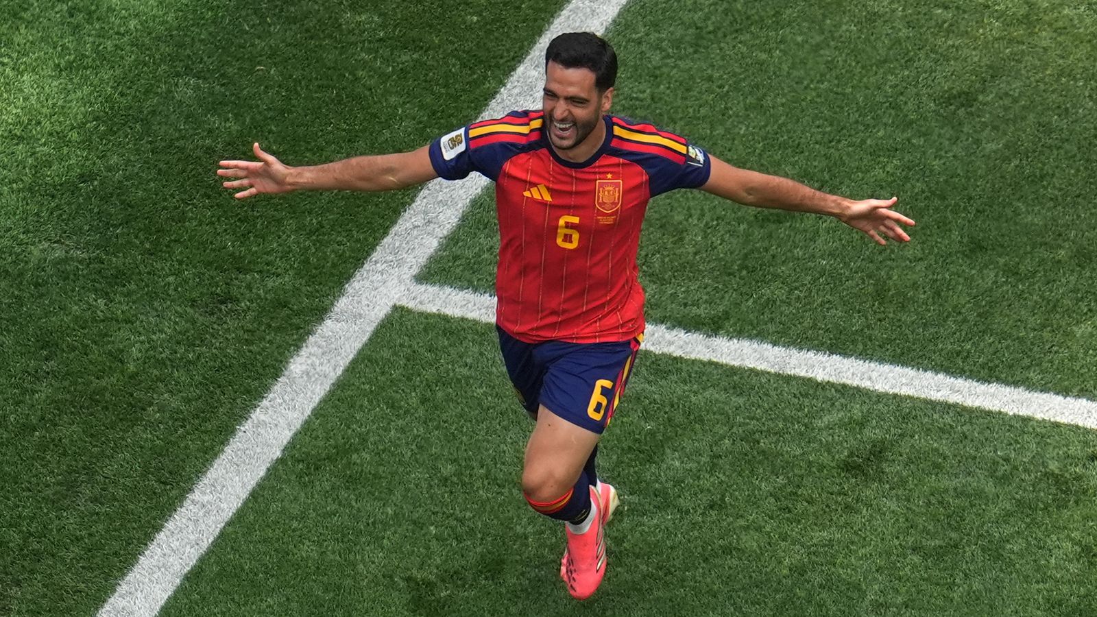 Spain's Mikel Merino (6) celebrates scoring their second goal