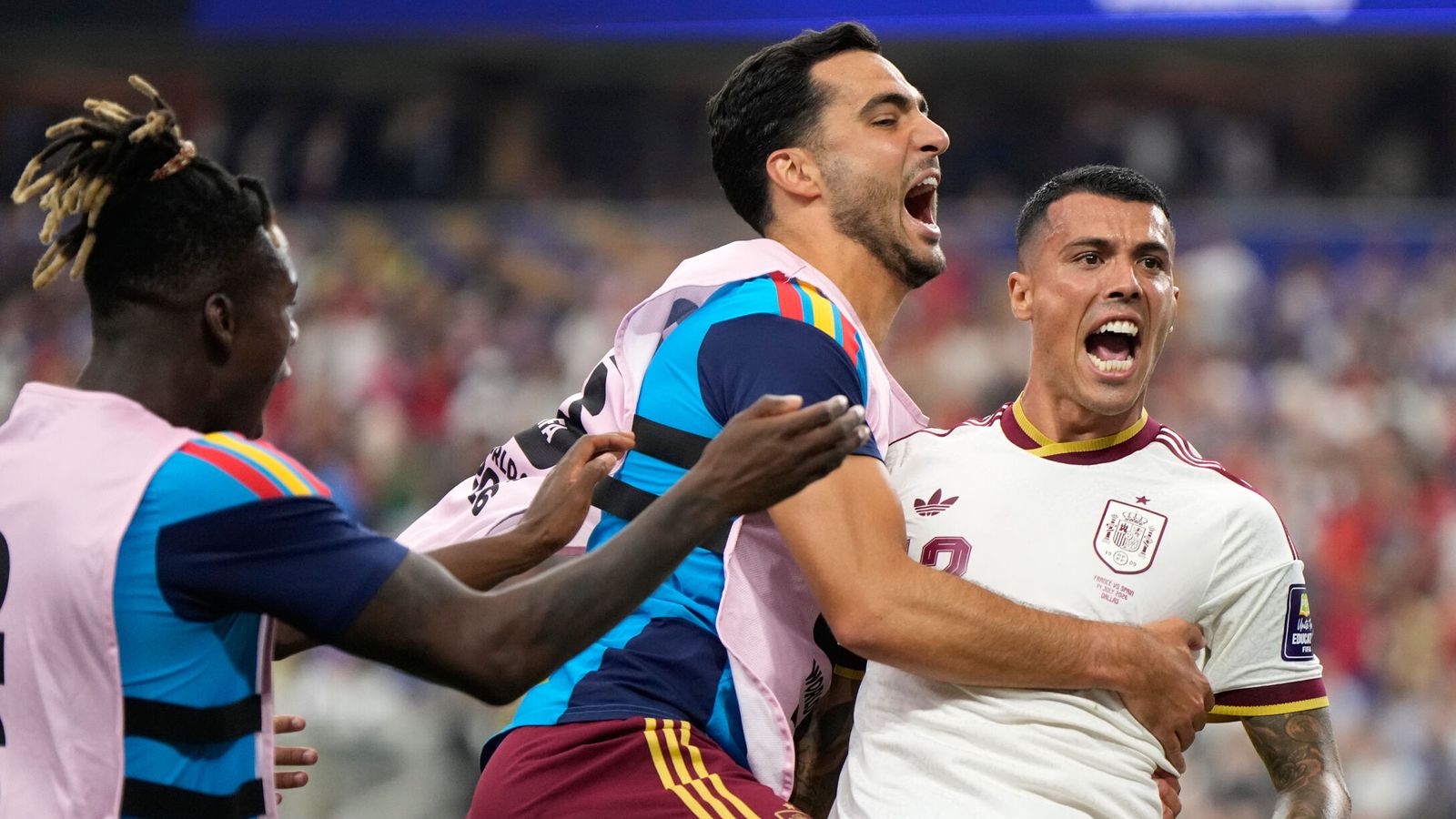 Spain's Pedro Porro, right, celebrates with Mikel Merino and Nico Williams