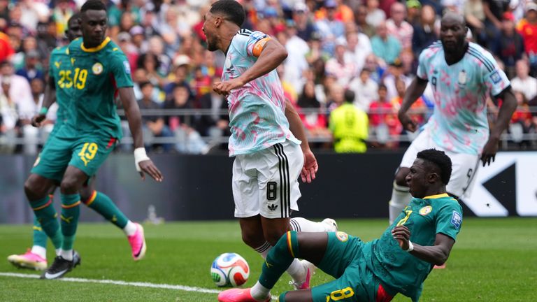 Belgium's Youri Tielemans is fouled by Senegal's Lamine Camara