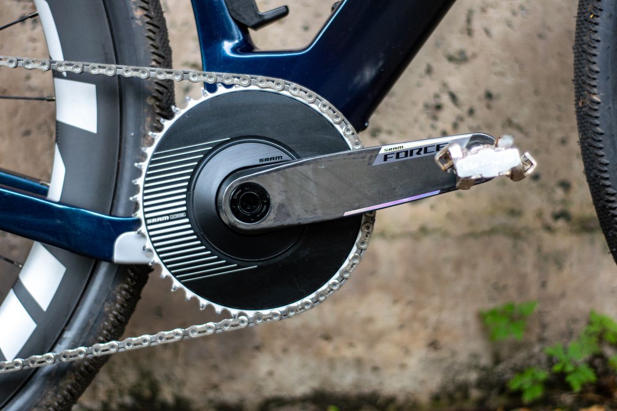 An Argon 18 Anti Matter gravel bike leaning against a concrete wall.