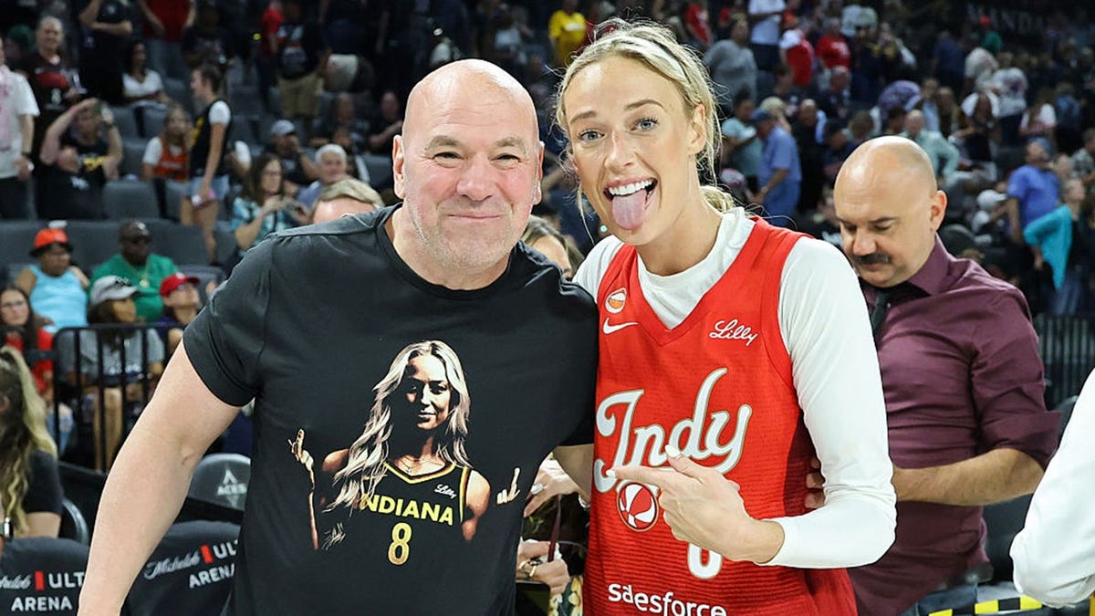 Dana White poses with Sophie Cunningham at Michelob ULTRA Arena.