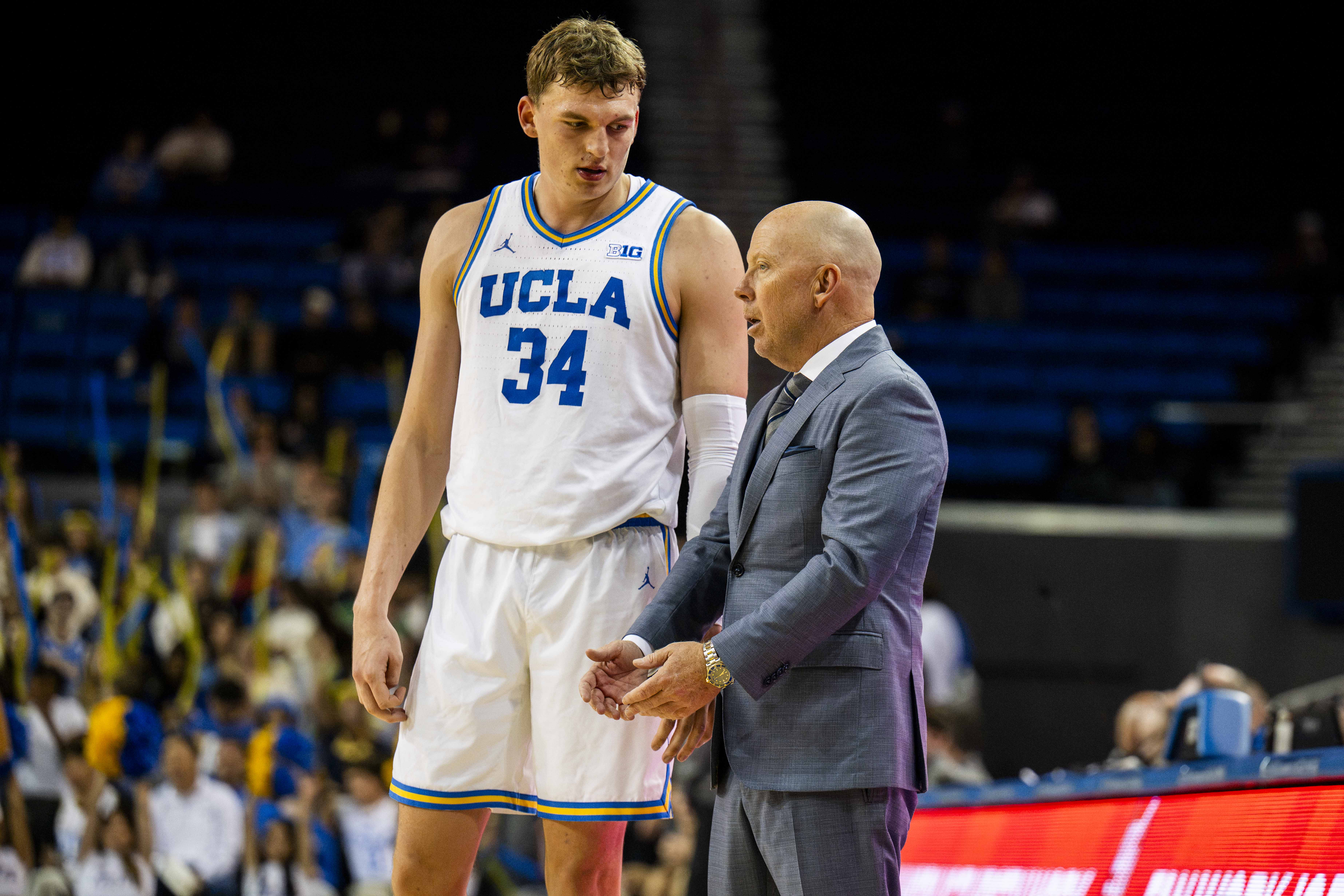Former UCLA forward Tyler Bilodeau (left) stands with men's basketball coach Mick Cronin (right). Bilodeau was the 43rd overall pick in the 2026 NBA Draft, to the Brooklyn Nets. (Andrew Ramiro Diaz/Photo editor)