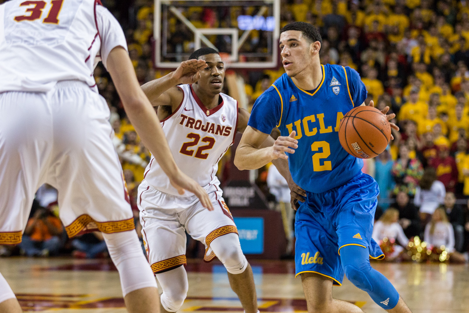 Former UCLA guard Lonzo Ball drives past former USC guard De'Anthony Melton. Ball is currently a free agent after being waived by the Utah Jazz. (Daily Bruin file photo).