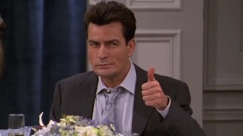 Charlie Crawford (Charlie Sheen) gives a sly thumbs up in Spin City