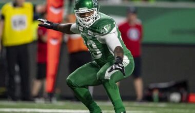 Charleston Hughes strikes a surfing pose on the field with the Saskatchewan Roughriders.