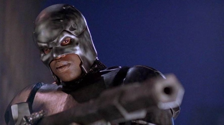 Steel (Shaquille O'Neal) holding a gun in Steel