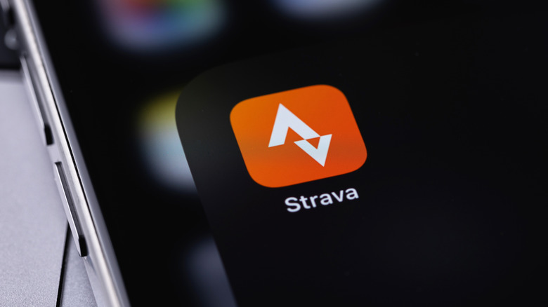 The Strava app icon on a smartphone