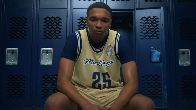 Jace Carson (Isaiah Hill) sits in a locker room contemplatively in Swagger