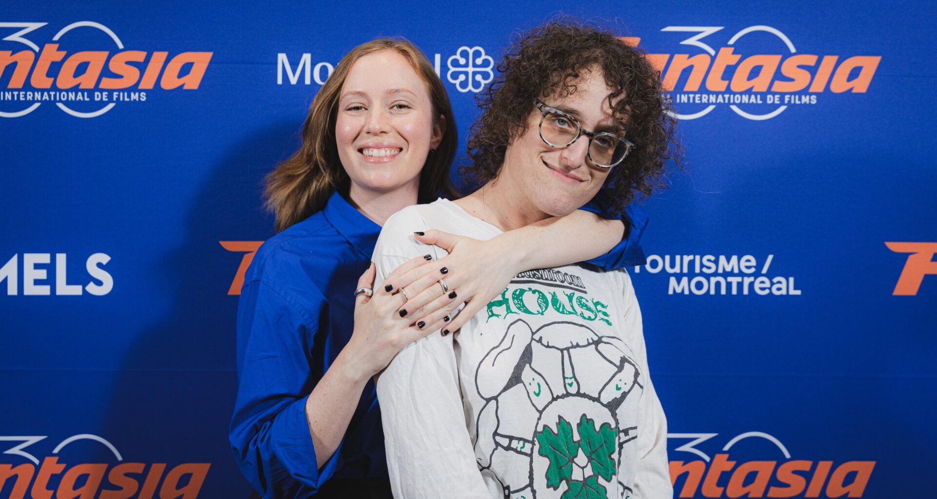 Two women pose for pics at Fantasia film fest.