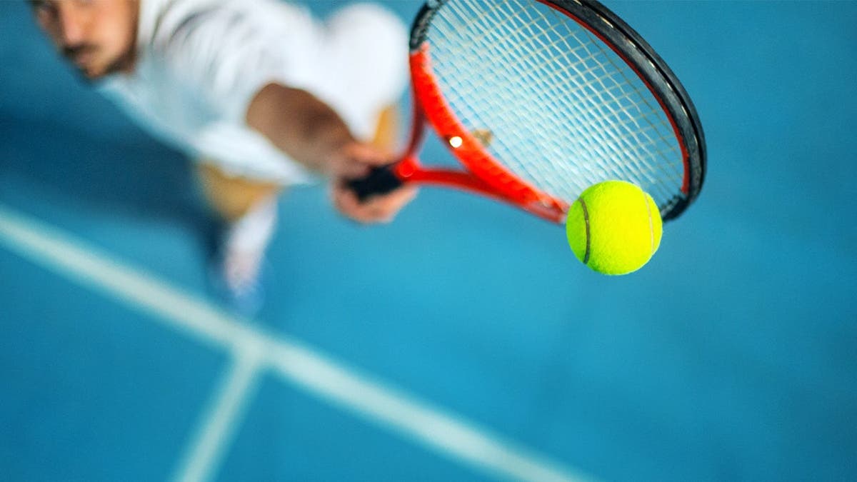 Man serving tennis