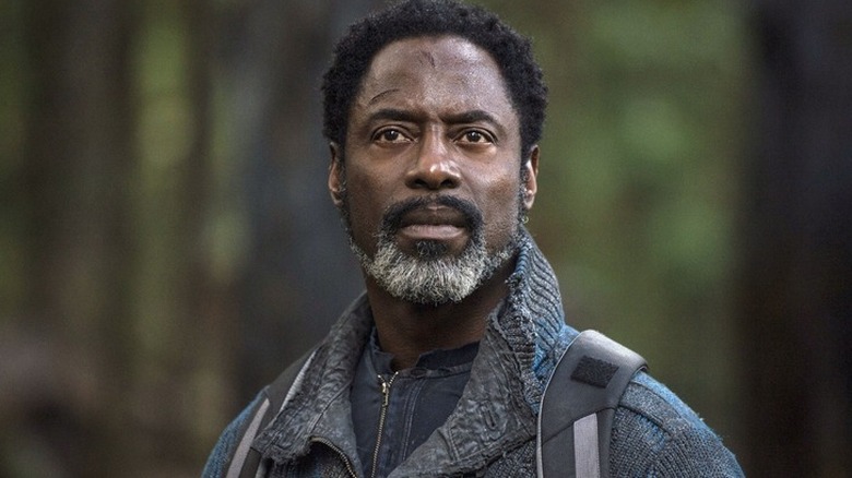 Thelonious Jaha (Isaiah Washington) looking at something on 