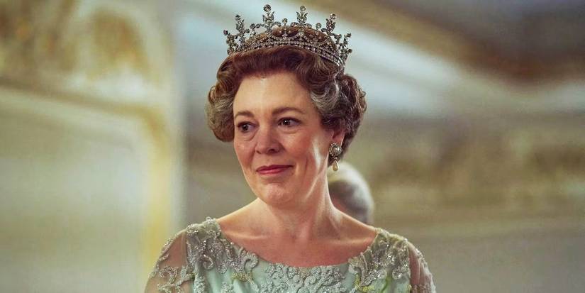 Olivia Colman as Princess Margaret smiling softly wearing a tiara in The Crown Season 4.