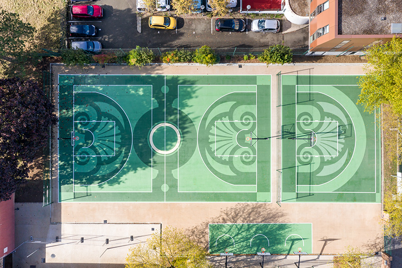playgones' basketball court echoes hues & emblems of historic château de versailles gardens