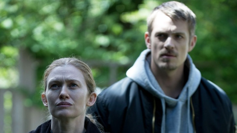 Homicide detectives Sarah Linden and Stephen Holder standing outside in The Killing Season 3