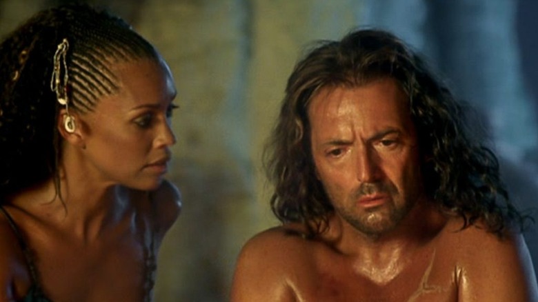 Calypso staring at Odysseus as he looks down
