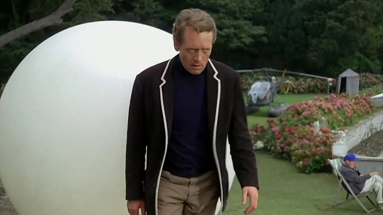 Patrick McGoohan as Number Six, walking away from Rover in The Prisoner.