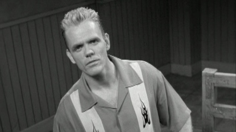 Christopher Titus peers at the camera in a black-and-white shot sequence in Titus
