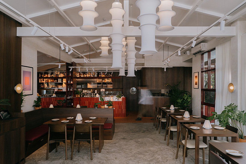 lantern-like pavilion and recycled brick bar reshape bangkok house into arvie restaurant - 2