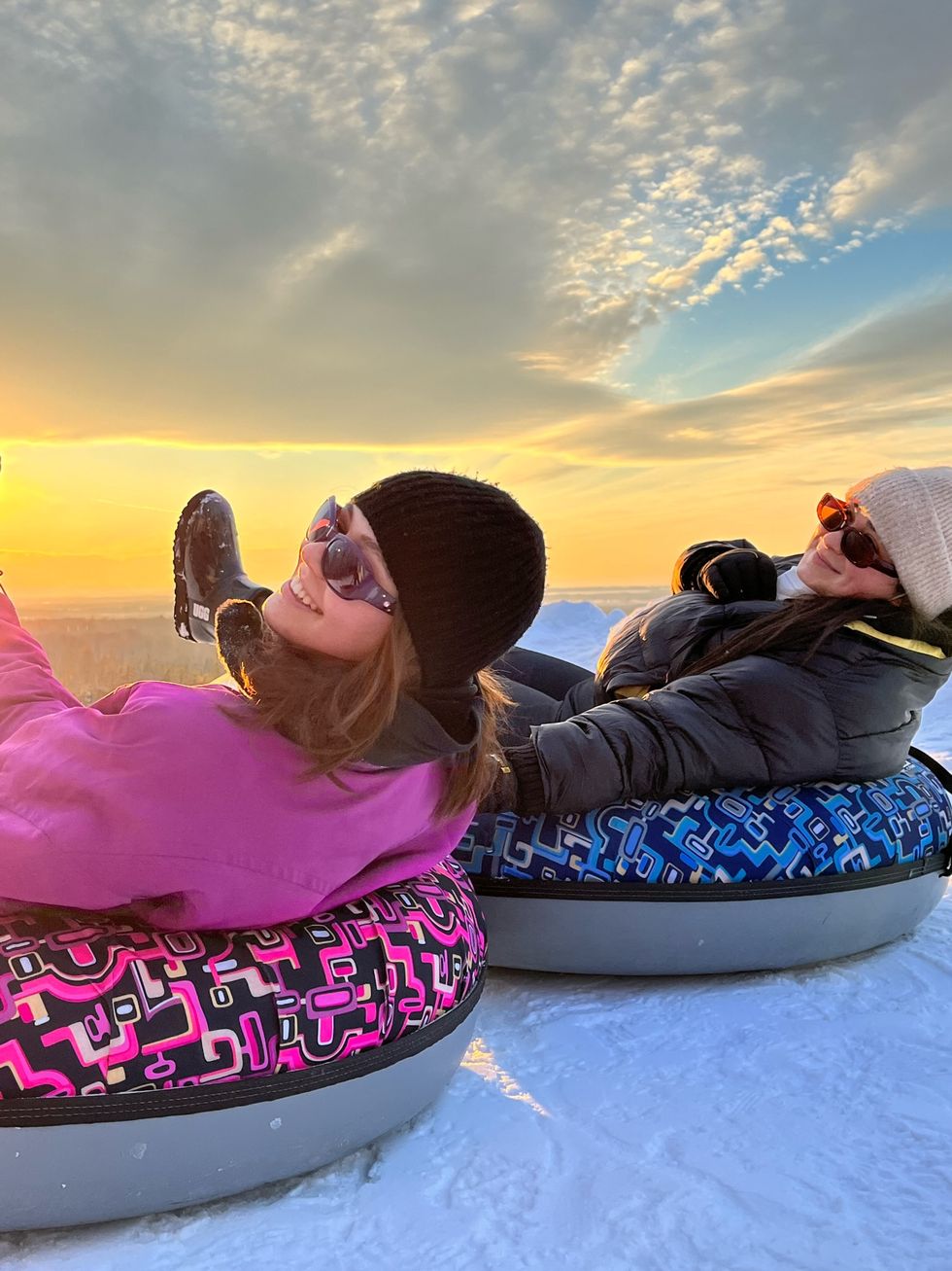 Two girls tubing
