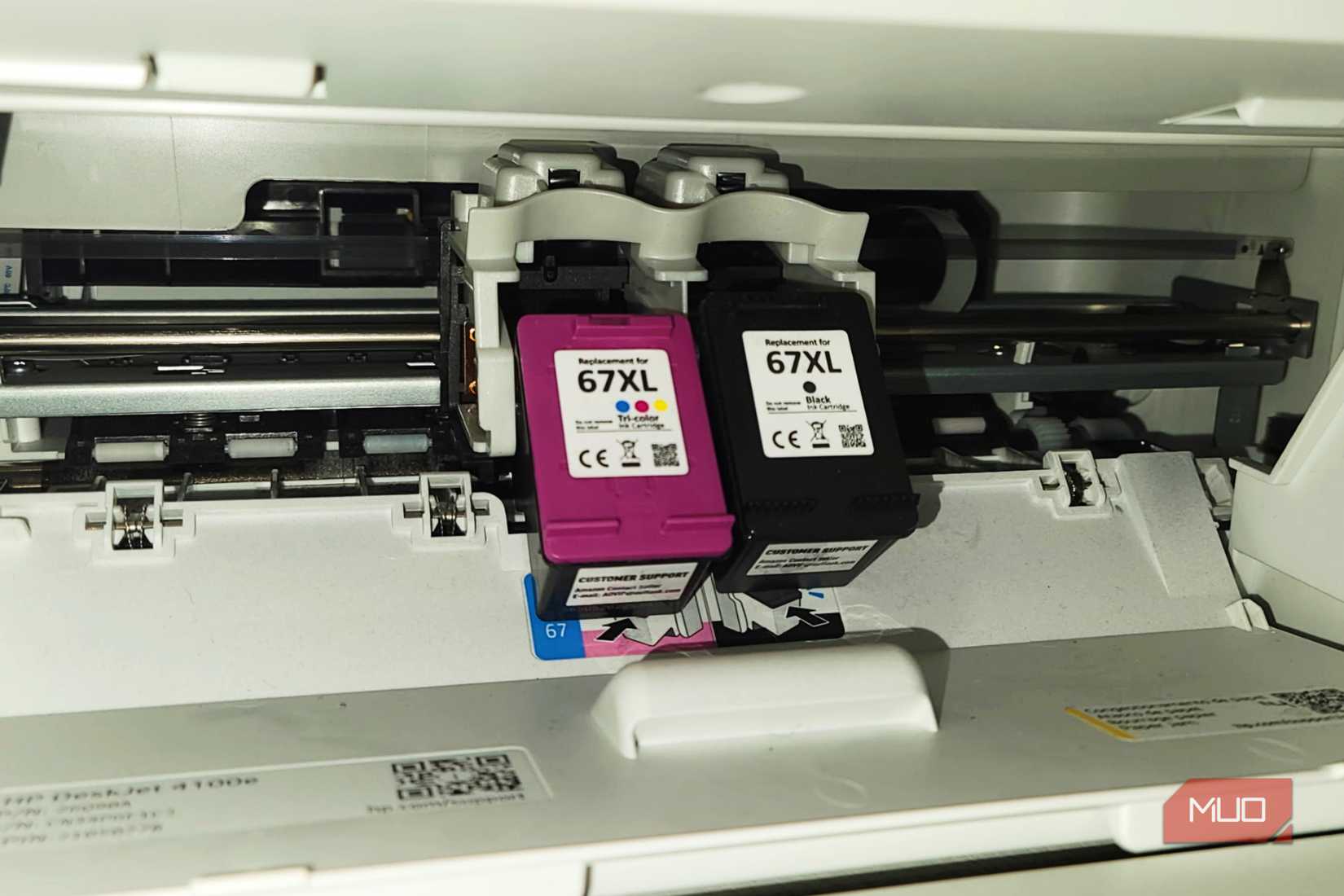 Two Printer Ink XL cartridges hanging in a printer