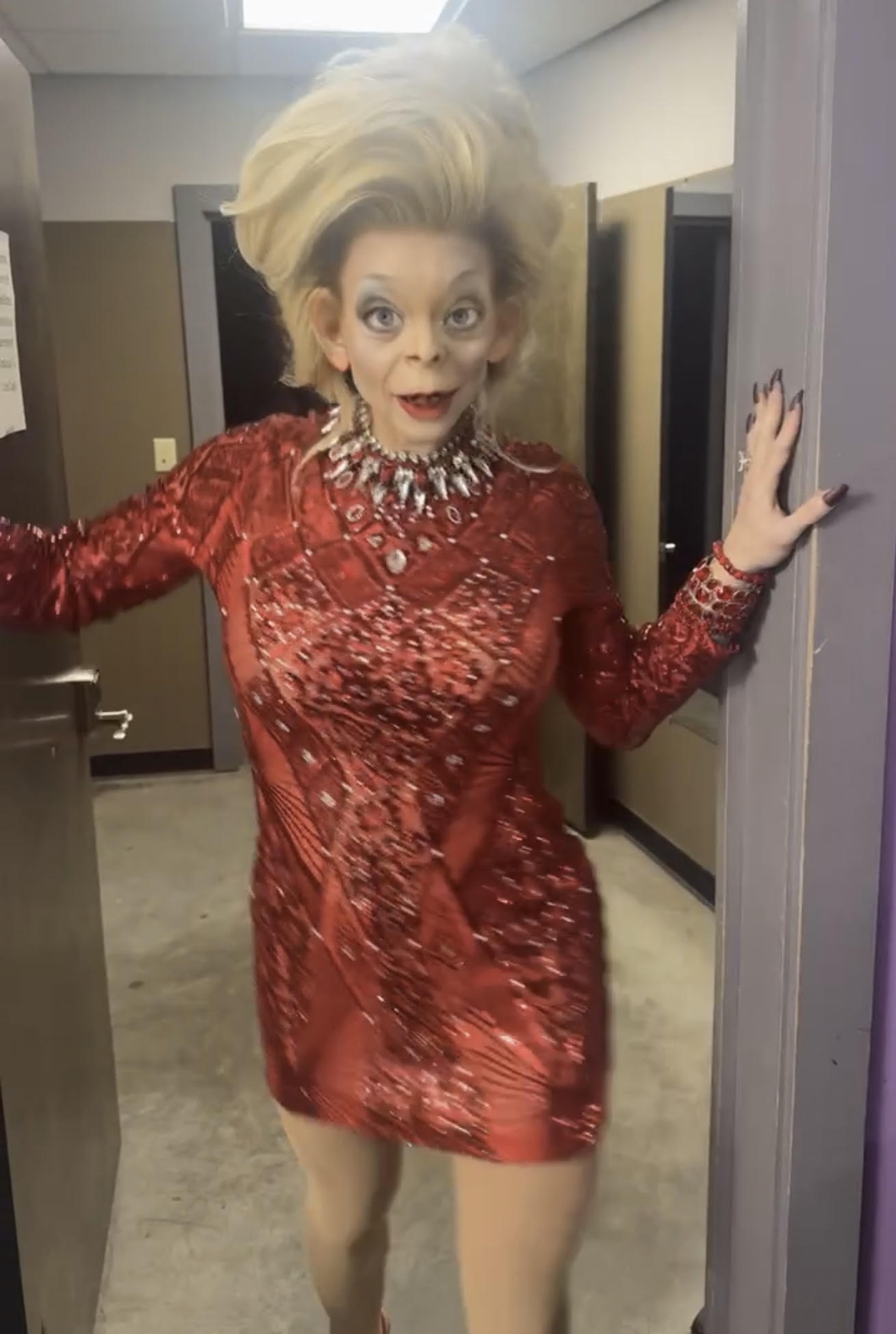 Katya Zamolodchikova in a red mini dress