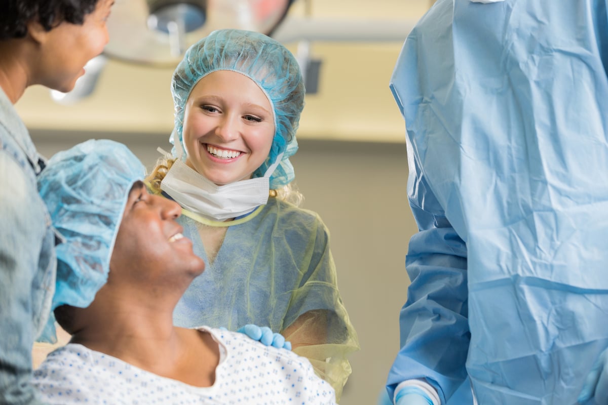 Nurses prepare a patient for surgery.