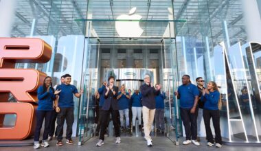 Apple CEO Tim cook standing outside of an Apple store.