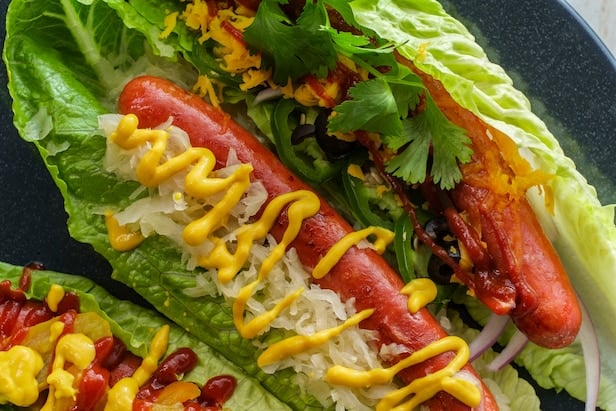 It’s Fourth of July weekend. You know you’re going to eat a hot dog or two. Just eat them this way, a sports nutrionist says