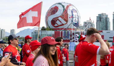 Switzerland fans march toward B.C. Place before a World Cup Group B soccer match against Canada, in Vancouver, on Wednesday, June 24, 2026.