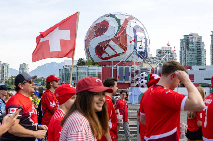 Switzerland fans march toward B.C. Place before a World Cup Group B soccer match against Canada, in Vancouver, on Wednesday, June 24, 2026.