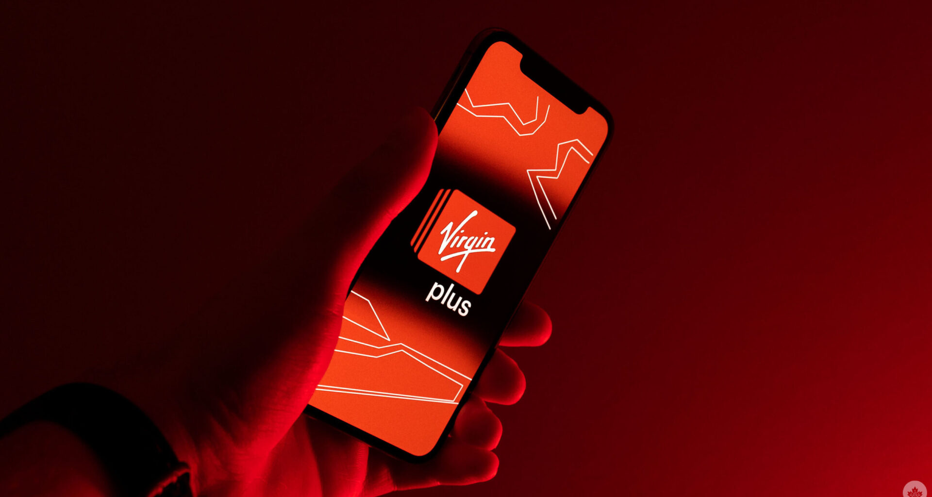Red Virgin Plus logo on a phone