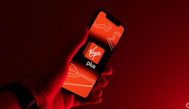 Red Virgin Plus logo on a phone