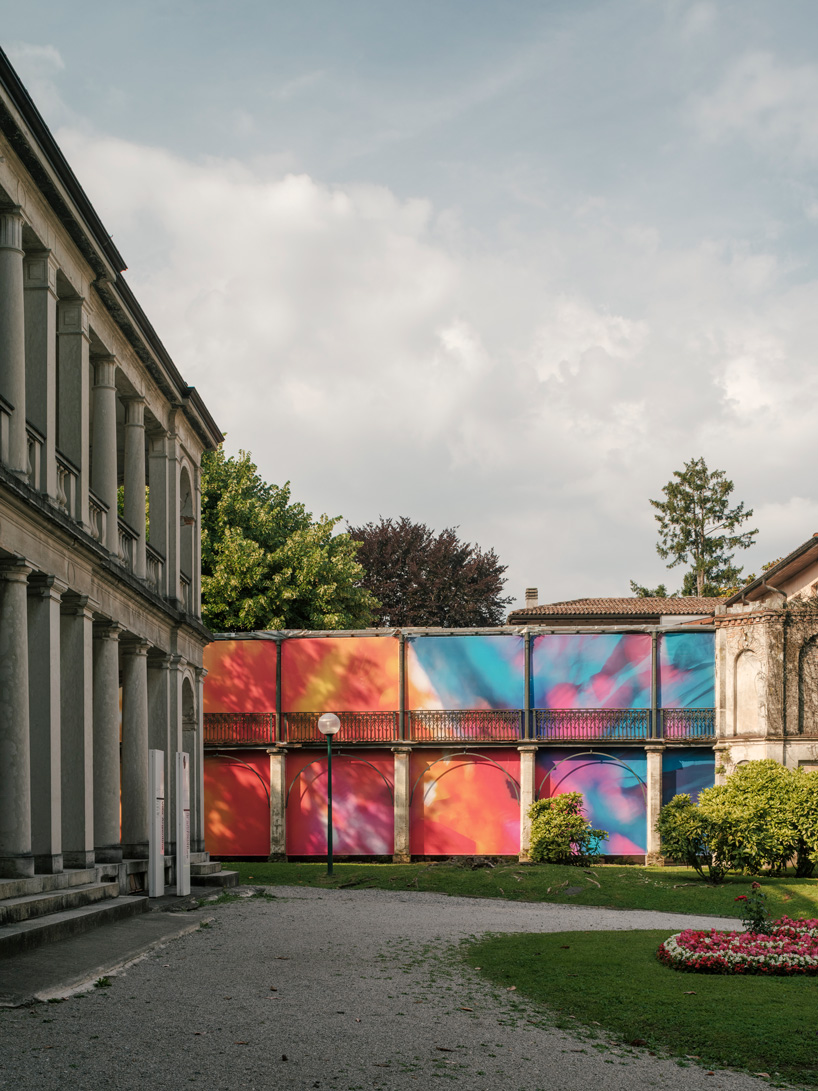 colorful printed textile installation reimagines historic laundry building facade in switzerland - 2