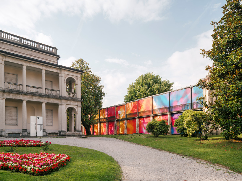 colorful printed textile installation reimagines historic laundry building facade in switzerland - 1