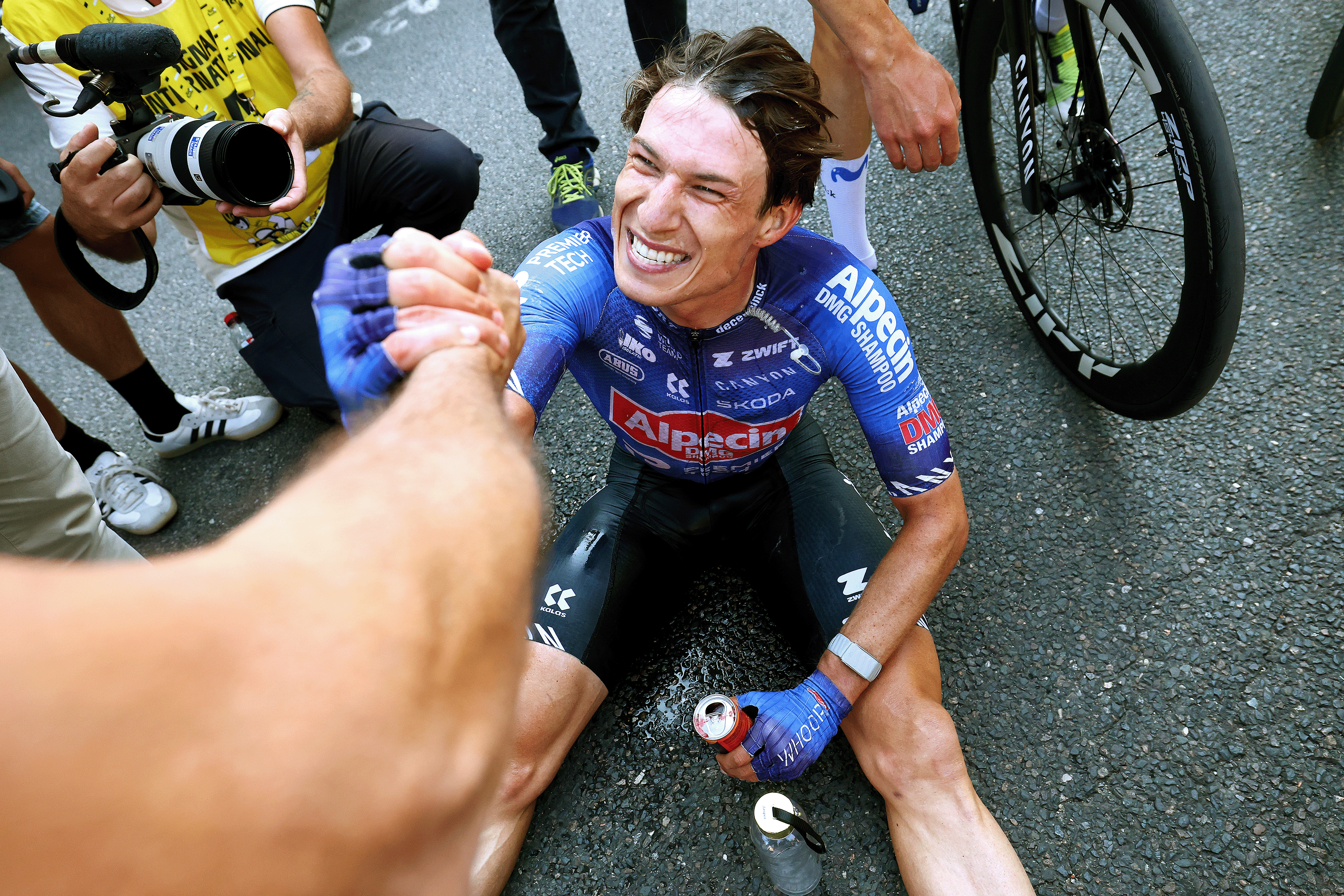 Stage winner Jasper Philipsen of Alpecin-Premier Tech reacts after winning stage 17