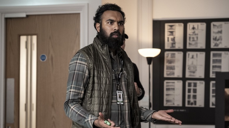 Daniel Kumar spreading his hands in exasperation in The Franchise