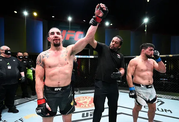 Filipino MMA fighter Joshua Pacio celebrates a win with his team