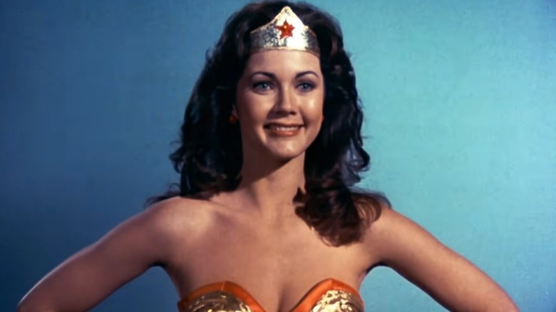Wonder Woman smiling with hands on hips