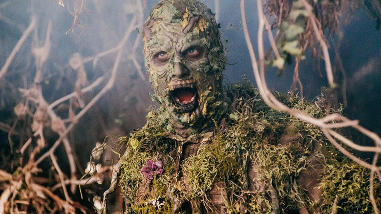 A close-up of a moss-covered zombie on 
