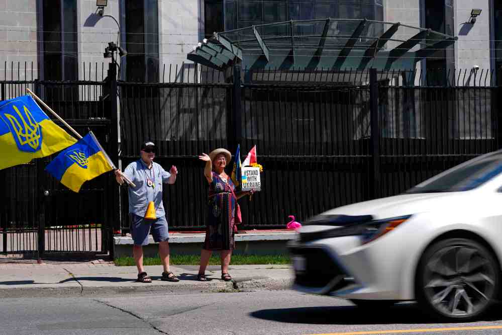 Supporters of Ukraine rally outside the Embassy of Russia in Ottawa, on Tuesday, Aug. 18, 2026. THE CANADIAN PRESS/Justin Tang